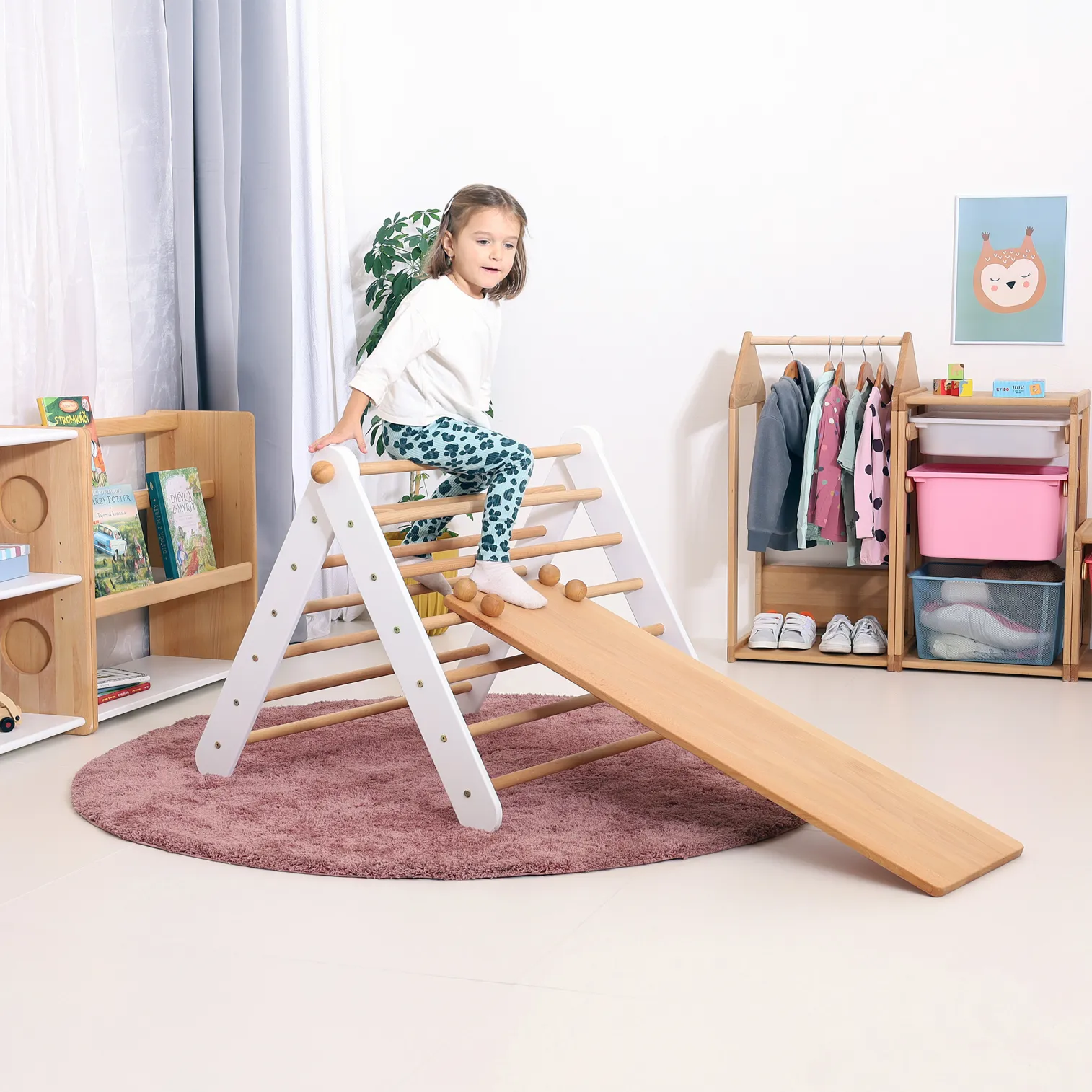 Montessori play corner with CLIMBIE wooden climbing triangle and cozy natural interior decor