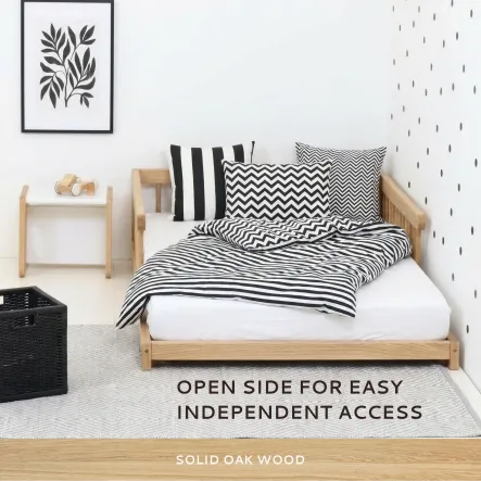 Montessori floor bed with protective rails on both sides, open entrance at the foot end